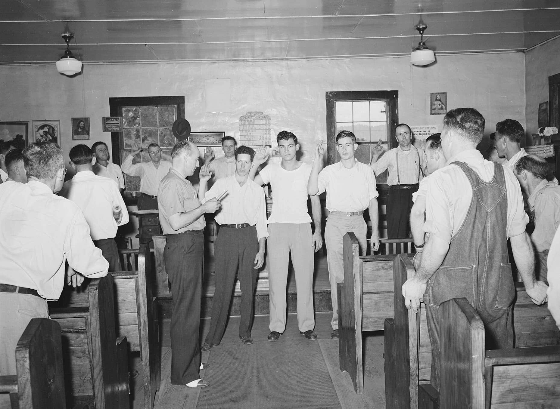 New members taking the union oath with hands raised, Harlan County, Kentucky, 1946