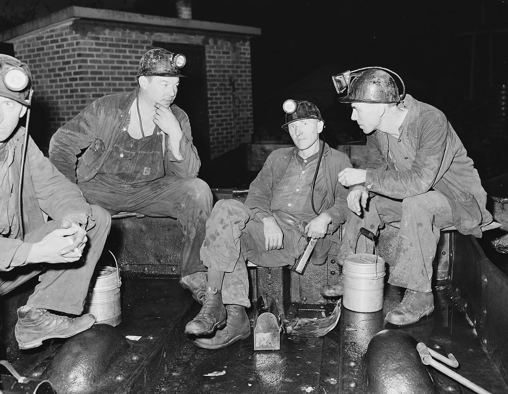 Coal miners talking at the mine portal between shifts, Wheelwright, Kentucky, 1946